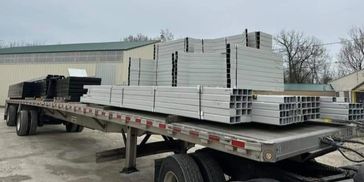 truckload full of 3' x 3' steel tubes and structural k braces