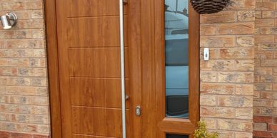 Golden Oak Solid Core door with a Golden Oak frame & matching mid rail side panel & Long Bar handle.