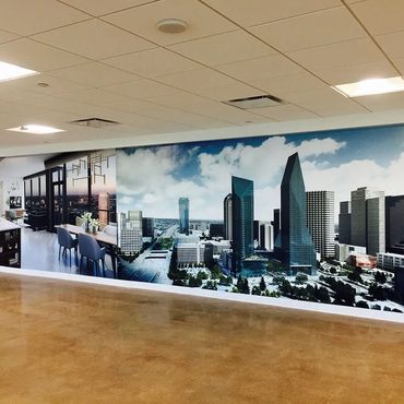 Large wall mural showing a modern apartment interior and city skyline.