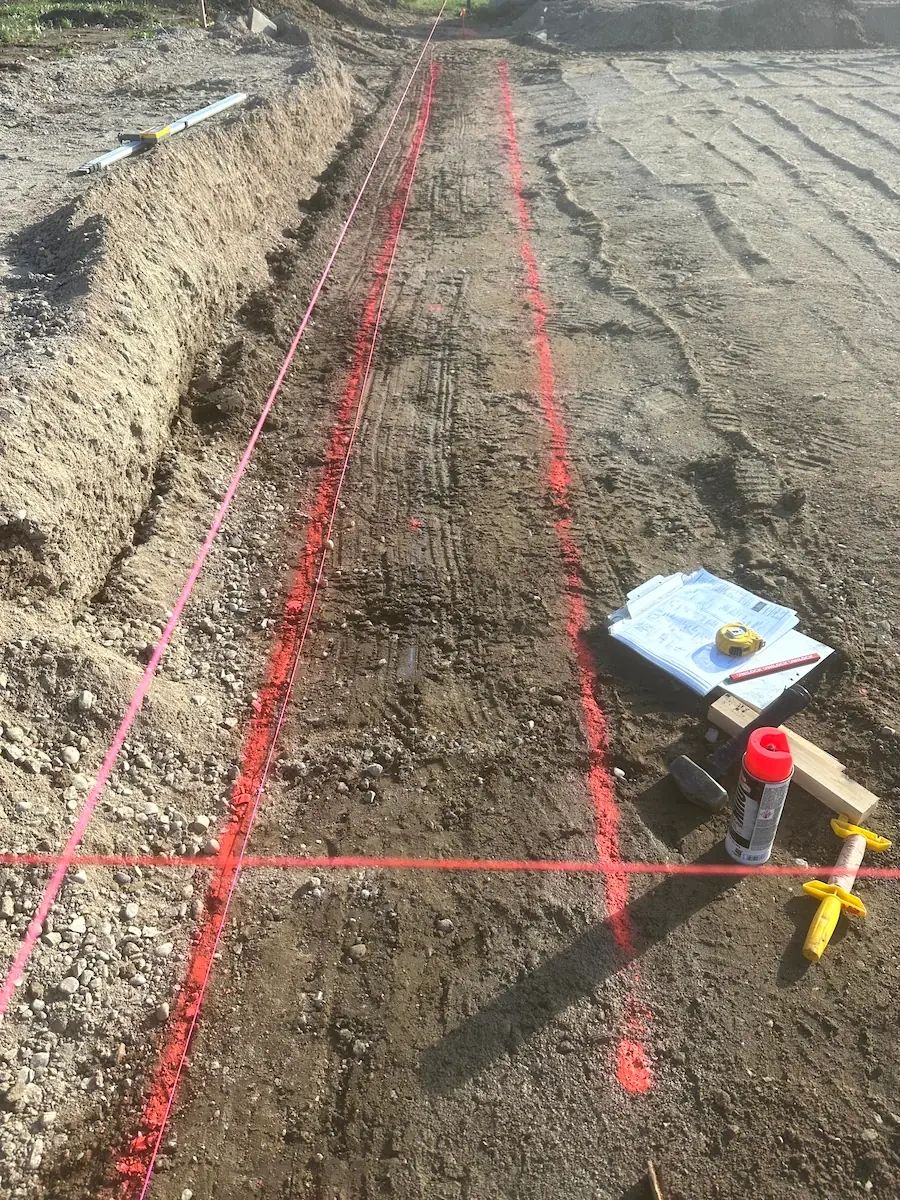 Structural base preparation and compaction in residential hardscape installation