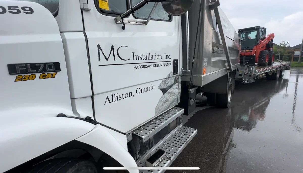 MC Installation Inc. truck and trailer on site in Simcoe County Ontario with full company branding