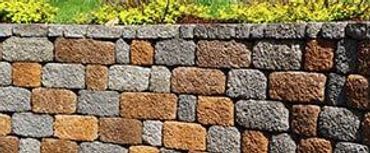 Multicolored brick retaining wall.