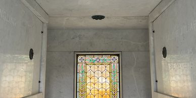 color image of the interior of the Henry Ringling mausoleum with a close up of the stained glass