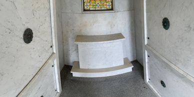 color image of the interior of the Henry Ringling mausoleum with a close up of the back plinth
