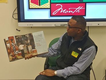 RWPGD JD Spain Sr. reading to the kids at Kenmore Black History Day - 2/16/24