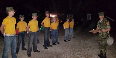 Young Marine Recruits in formation at night.