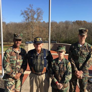 Young Marines with a local World War II veteran.