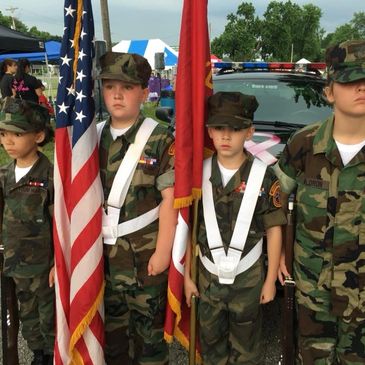 Young Marines standing ready for a Color Guard.