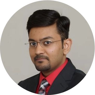 Professional man in glasses wearing a suit and tie.
