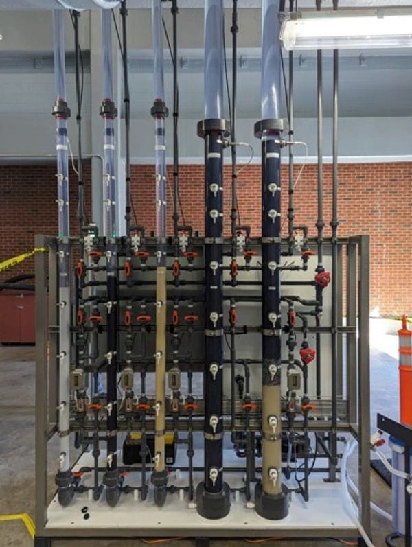 Complex industrial piping system with valves and gauges in a facility.