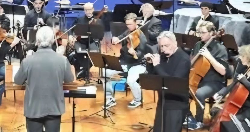 Berten D"Hollander performing the premier of a double concerto featuring all flutes and viola.