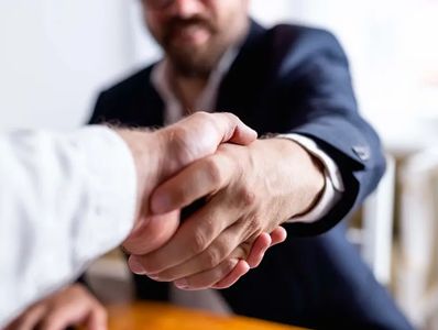 two men shaking their hands