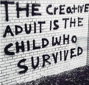 Black Graffiti on a white brick wall that says The Creative Adult is the child Who Survived