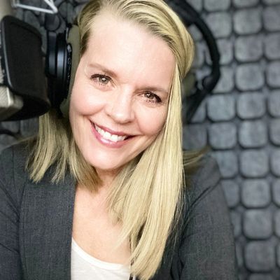 Deanna Johnston voice over actor in studiobrick isolation booth. Neumann TLM103 microphone.