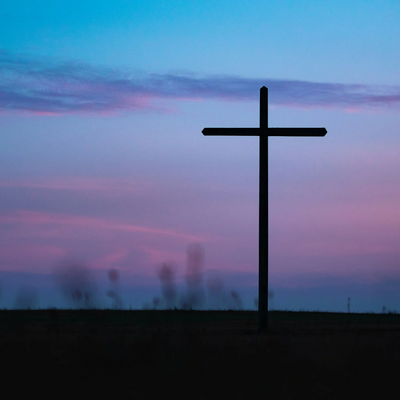 Christian Cross outside at twilight or sunrise.