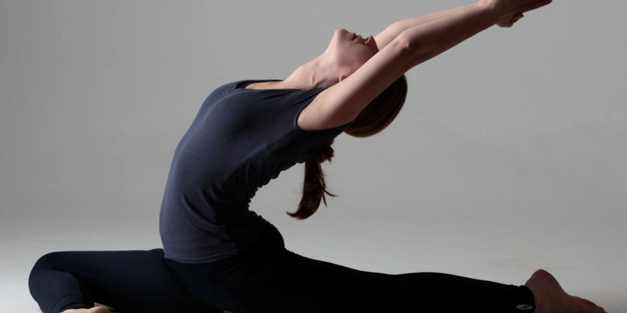 Woman in a pigeon pose (Eka Pada Rajakapotasana)
