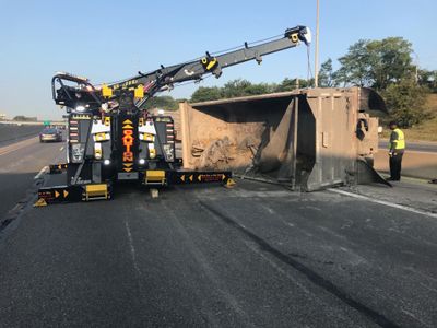 A Dumpster overturned on the freeway and Detroit Towing Association came to the rescue