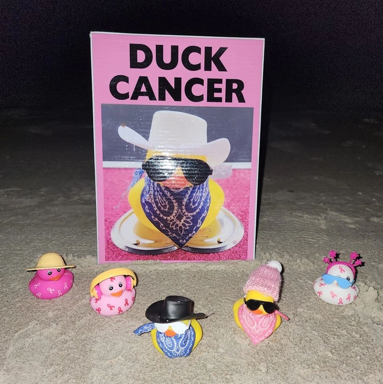 Rubber duckies in the sand ducking cancer. All cancer sucks!