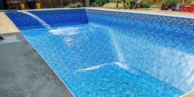 Empty pool being filled with water streams.