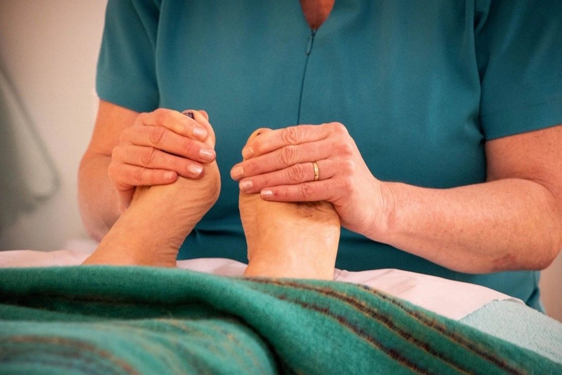 Person receiving a foot massage.