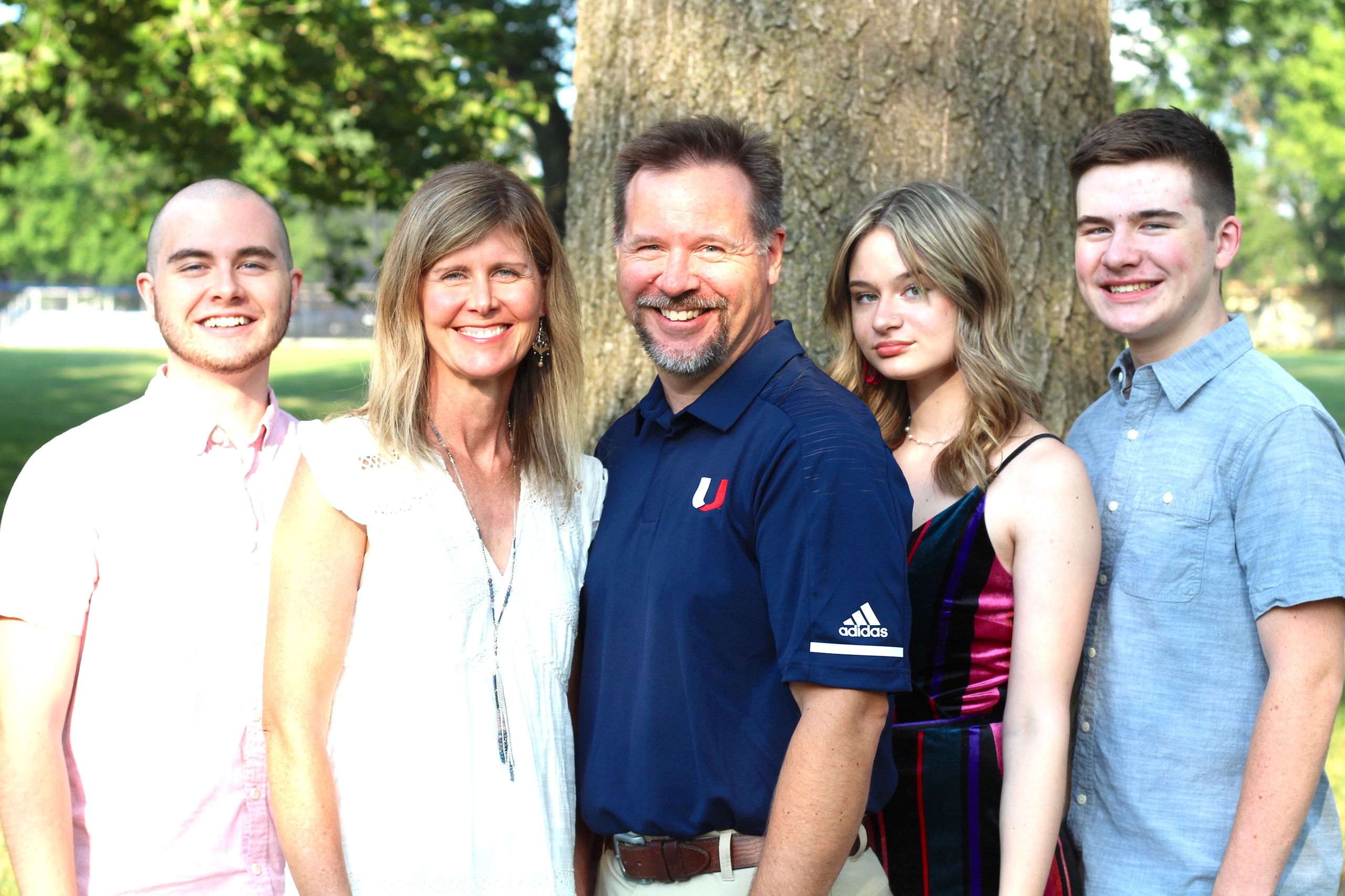 Jason and Tamara Menke, with their three children: Andrew (UHS 2018), and Kennedy and Carter (UHS 20