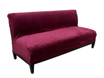 Stylish purple velvet sofa with black legs.