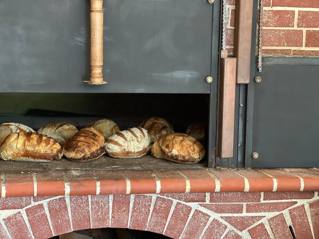 Our wood fired bread oven produces just like the old days!