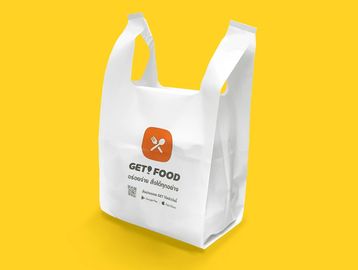 White food delivery bag with logo on yellow background.
