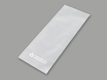 Empty white paper bag with recycle symbol.