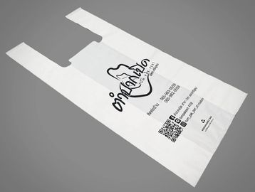 White plastic shopping bag with text and QR code.