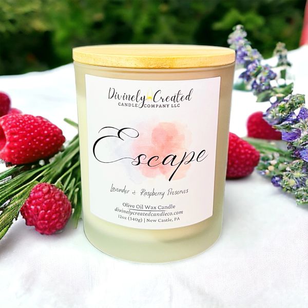 Candle labeled "Escape" with lavender and raspberry scent.