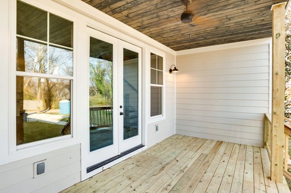 back door with wooden deck
