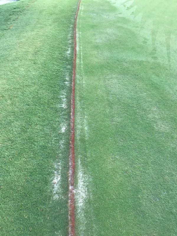 Immediately after install. Faint line, but not enough to bother golfers from playing.