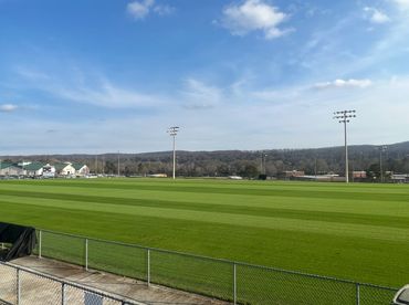 Professional Turfgrass Services managing a soccer field after overseeding.
