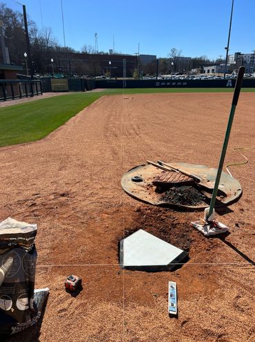 Professional Turfgrass Services resetting baseball bases through dirtwork.