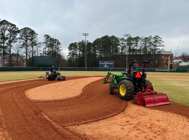 Professional Turfgrass Services laser grading baseball field and ABI force.