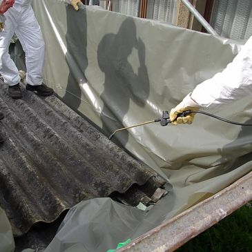 asbestos removal operatives working with an asbestos roof