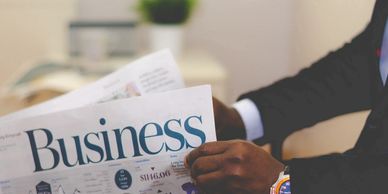 business person reading a newspaper