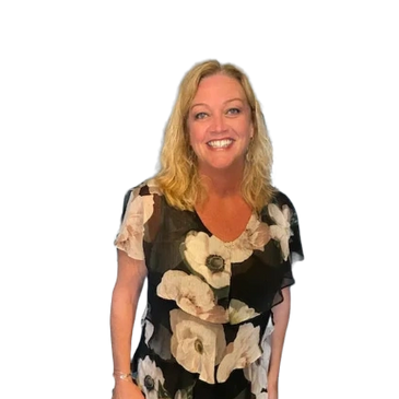 A picture of our President, Carrie Roberts, in a flowered dress and wearing a big smile!