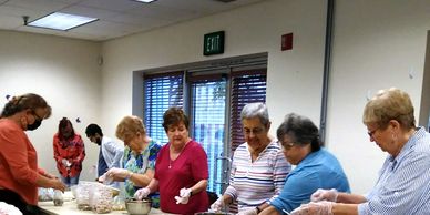 Walnut Valley Women's Club members assembling Friendship Soup