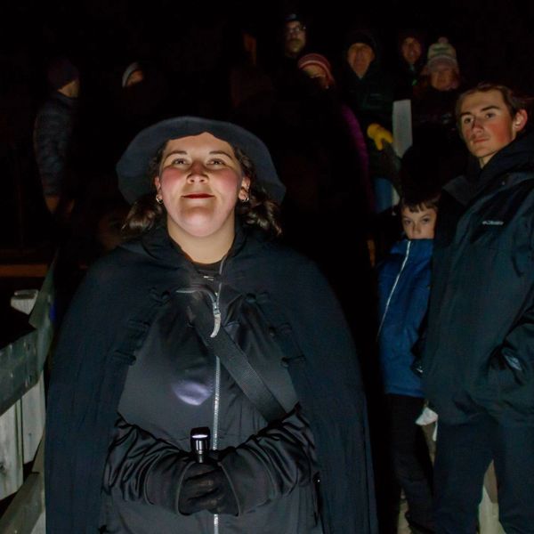 Maxine, standing in front of a group of Ghost Walk participants