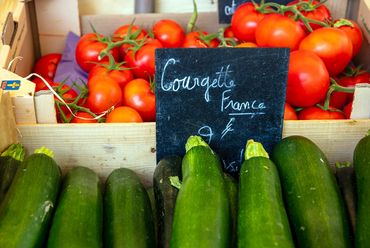 "French Market Day"
A crate of "Courgette France" cucumbers and tomatoes on the vine.