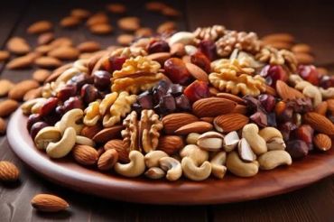 A plate with mixed nuts including walnuts, almonds, and cashews.