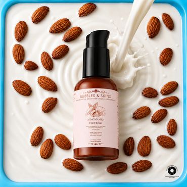 Almond milk face wash bottle surrounded by almonds and creamy milk splash.