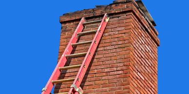 a ladder on the tall bricks building