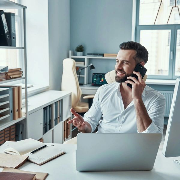 Businessman at desk on phone- Staying sharp: Stress Mastery For Senior leaders Online Course