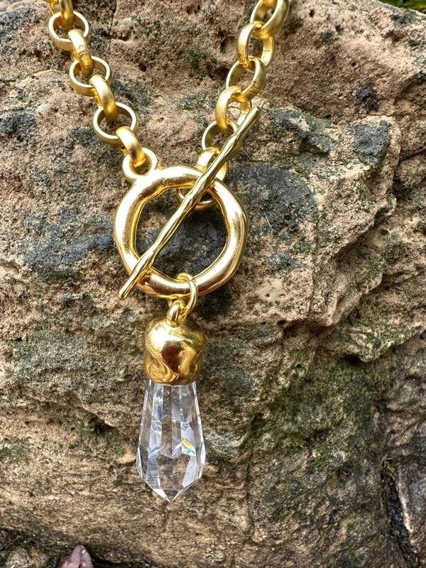 Classy gold necklace with crystal prism and front hammered toggle.  Very classic!