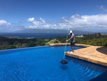 Man cleaning a pool