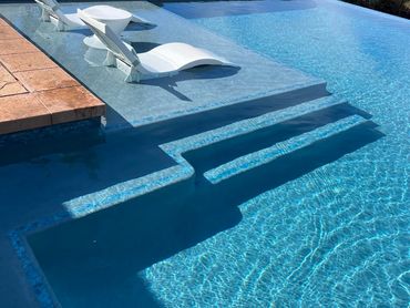 Pool with lounge chairs