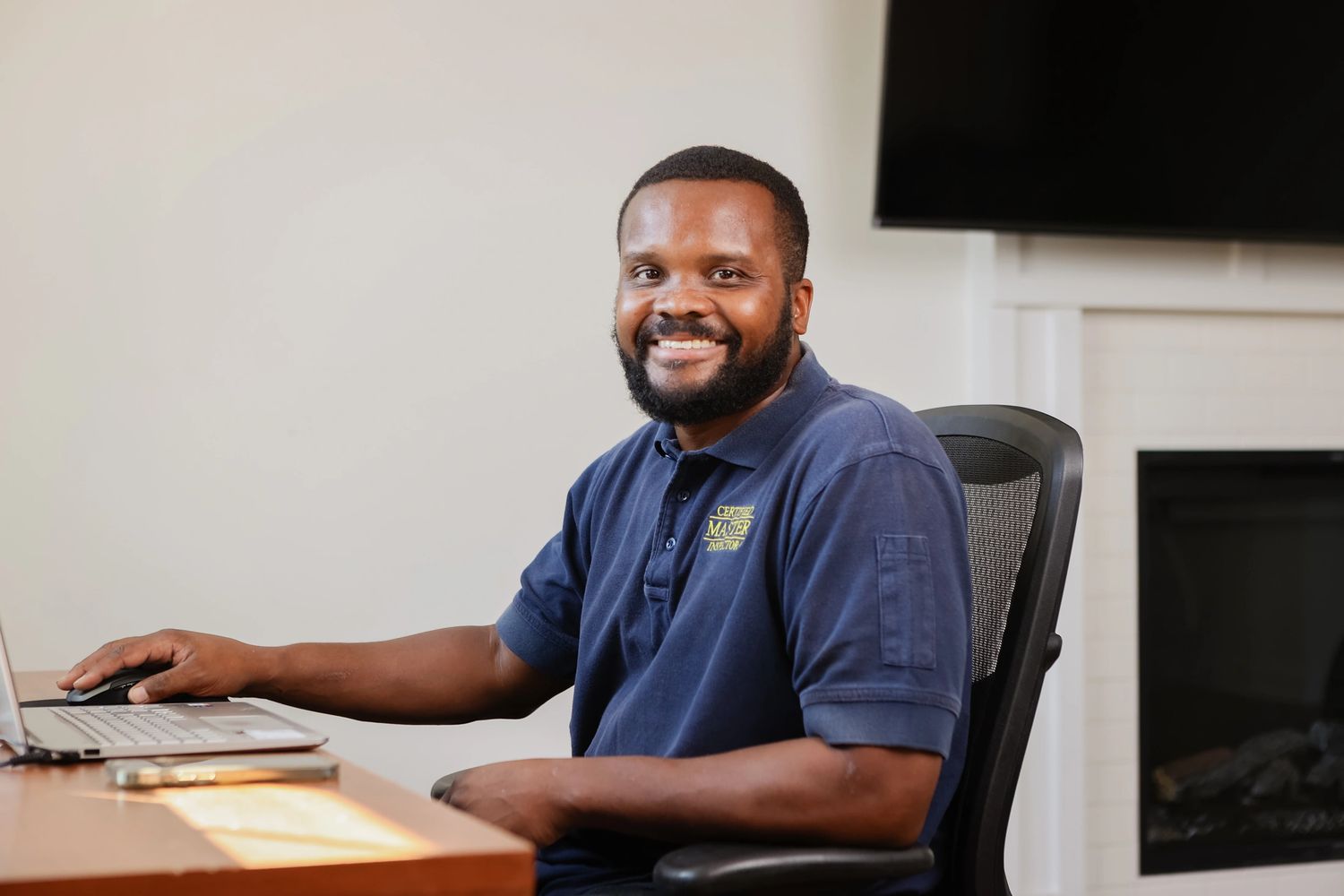 A man sitting in chair and giving still for photo